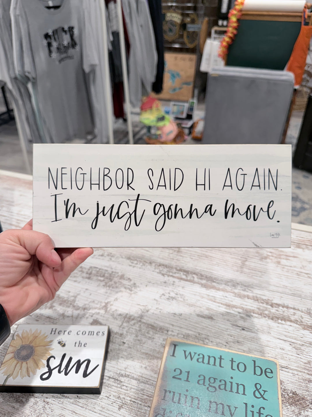 Neighbor said hi again sign